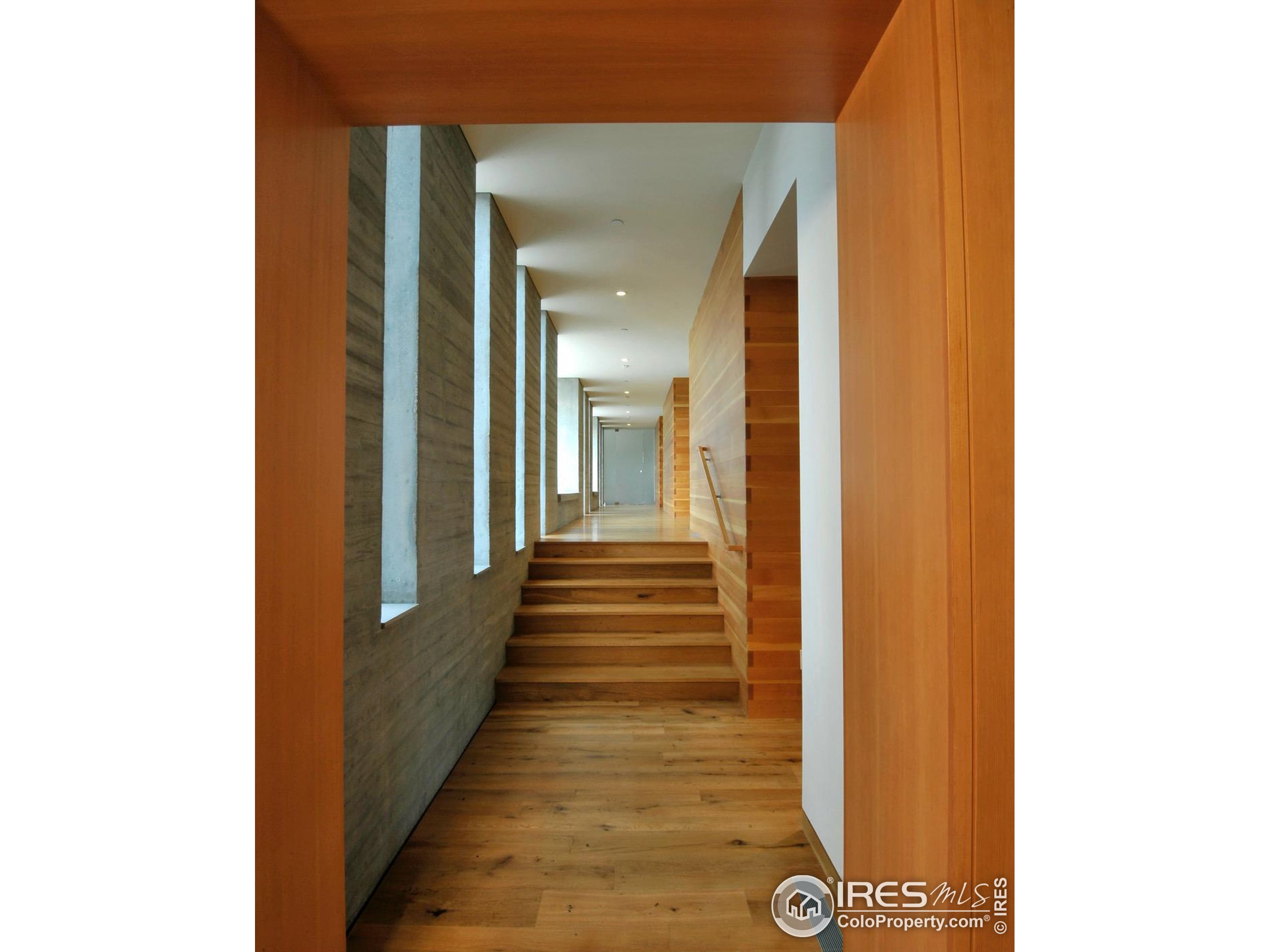 1355 South Cherryvale Road Boulder, CO 80303 - Photo 15 of 40 a view of a hallway with wooden floor