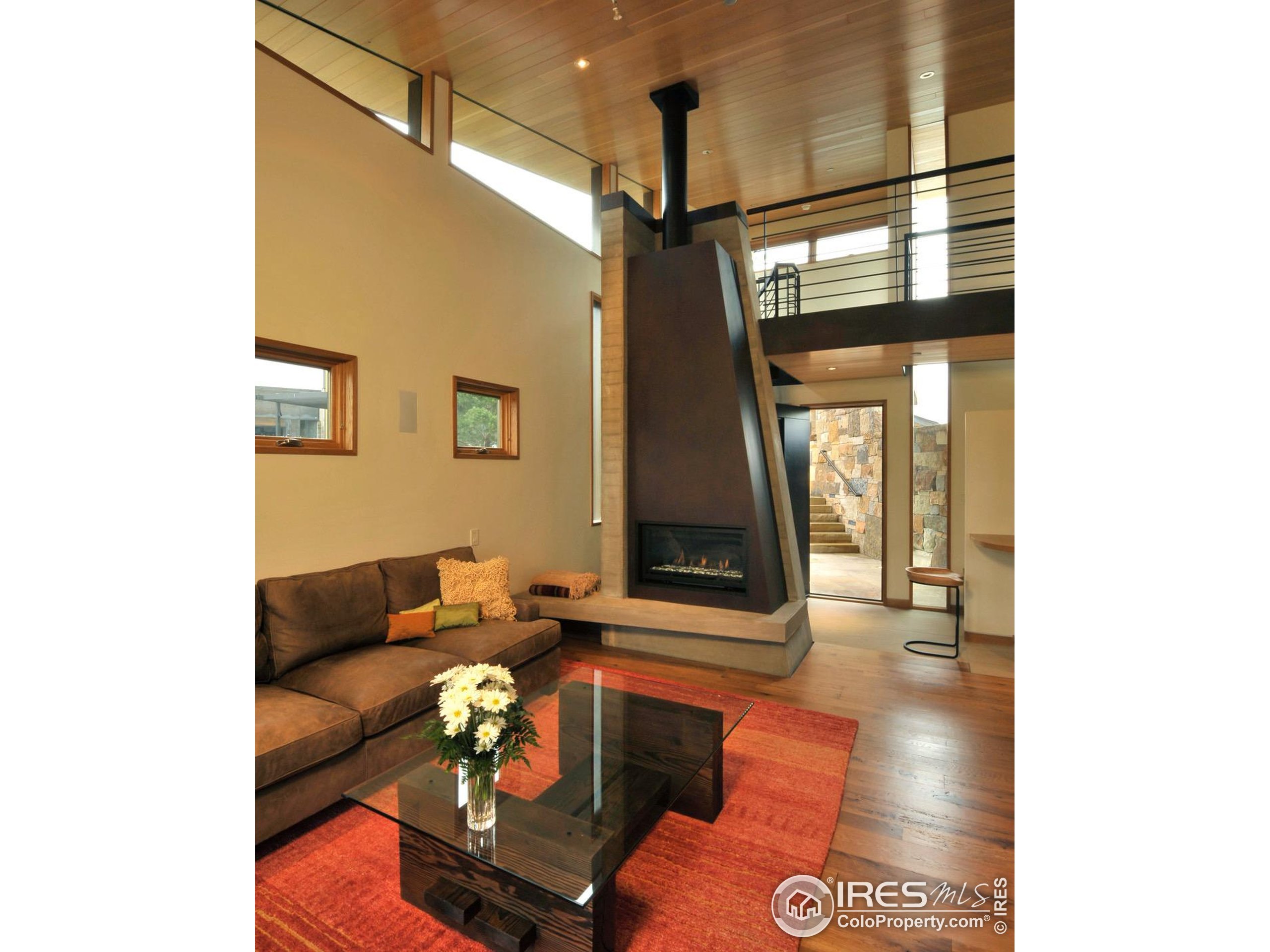 1355 South Cherryvale Road Boulder, CO 80303 - Photo 19 of 40 a living room with furniture and a floor to ceiling window