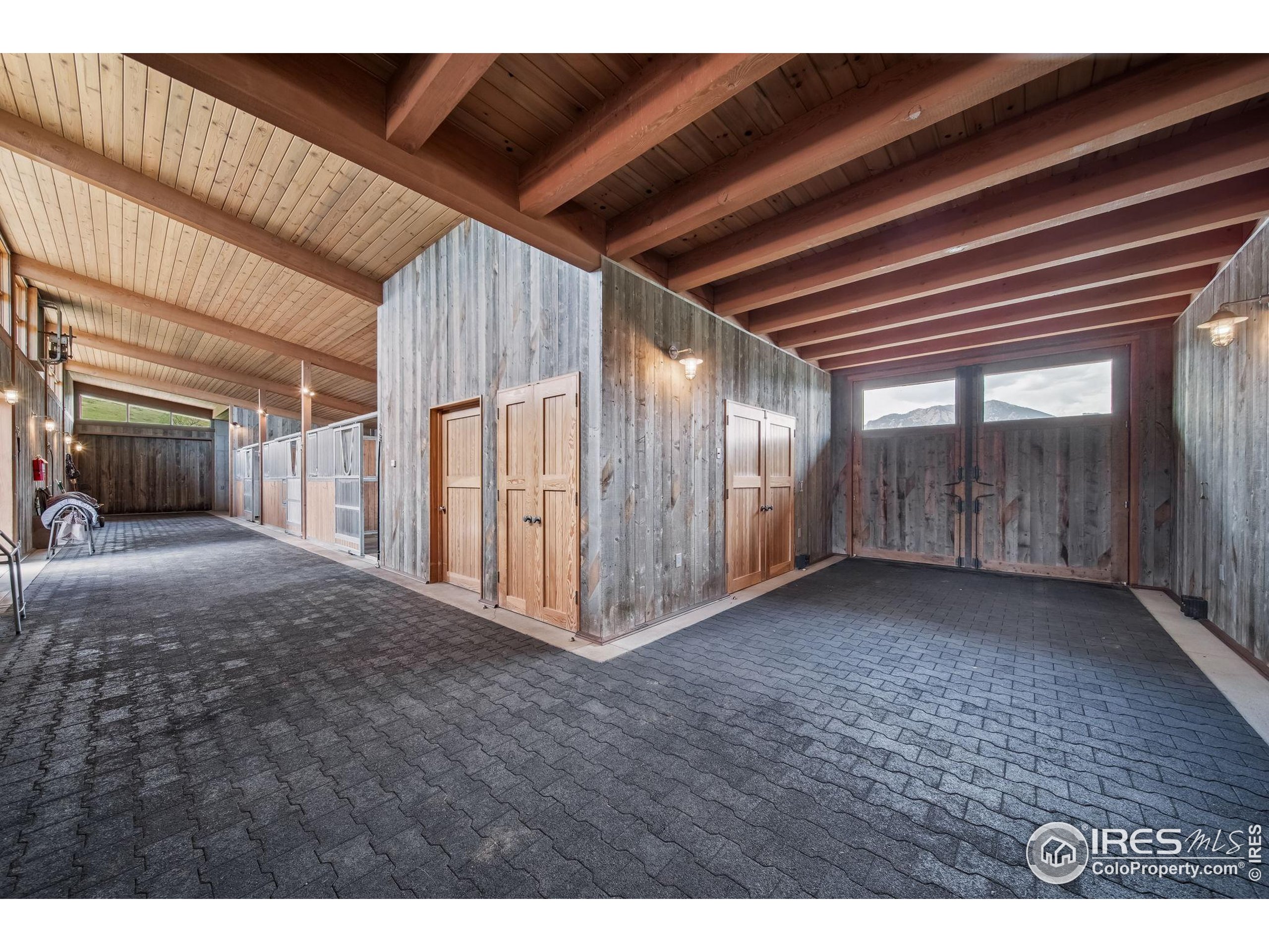 1355 South Cherryvale Road Boulder, CO 80303 - Photo 29 of 40 a view of an empty room with wooden floor