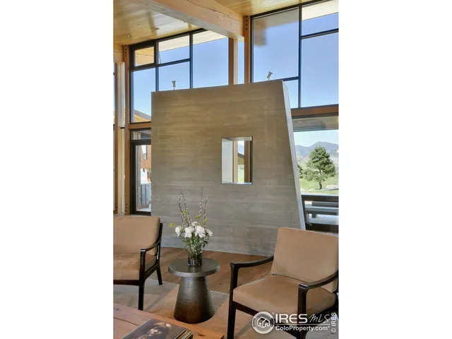 a view of a room with a table and chairs