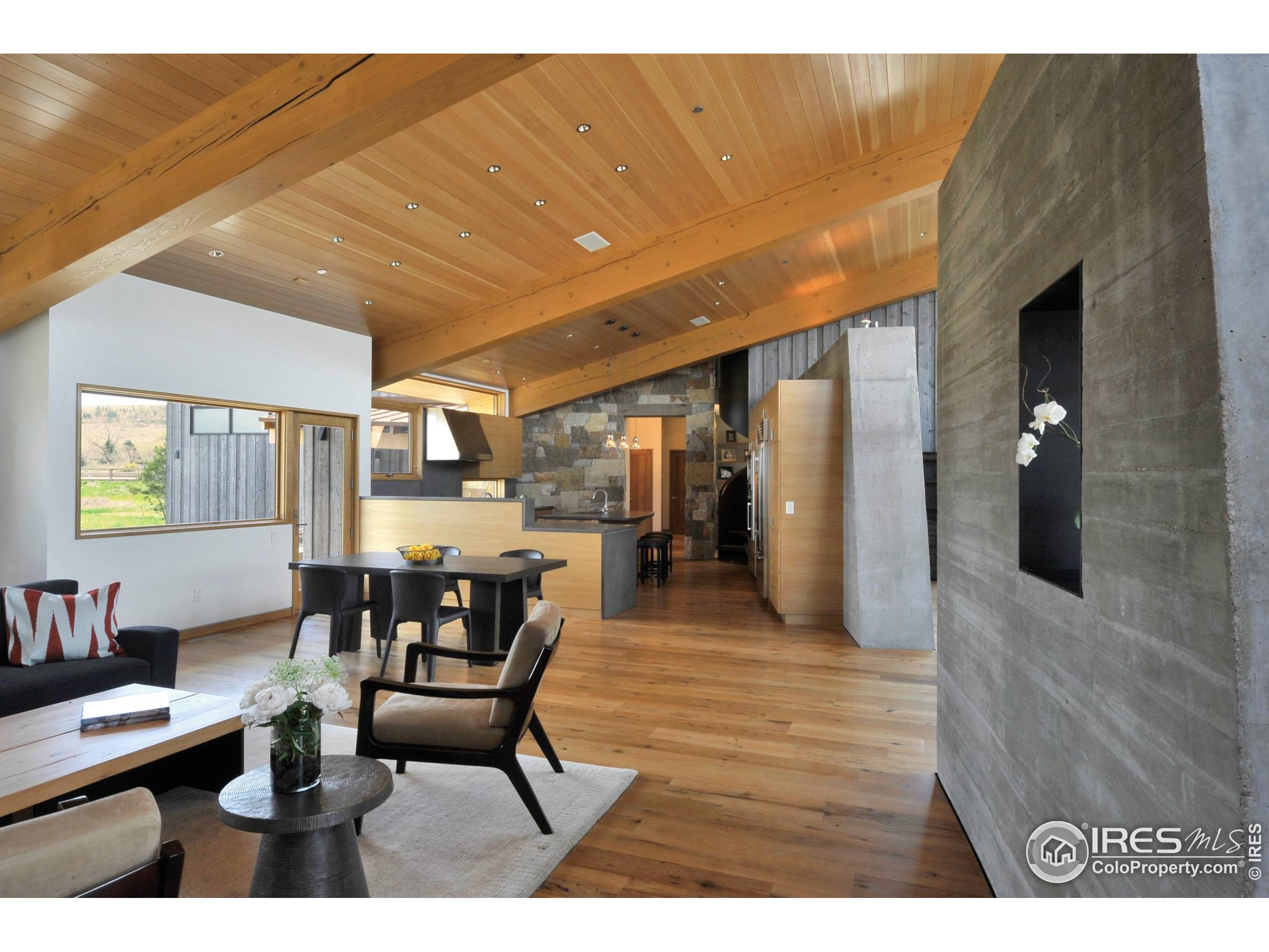 1355 South Cherryvale Road Boulder, CO 80303 - Photo 9 of 40 a dining room with furniture and wooden floor