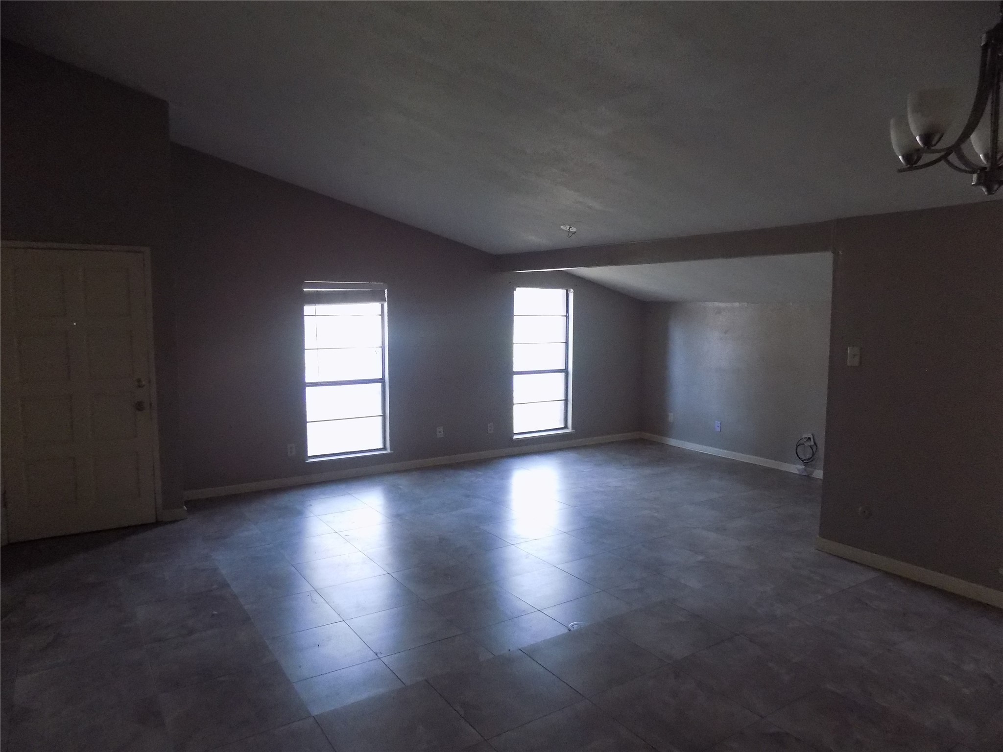 16807 Clan MacIntosh Drive Houston, TX 77084 - Photo 4 of 14 a view of wooden floor and windows in a room
