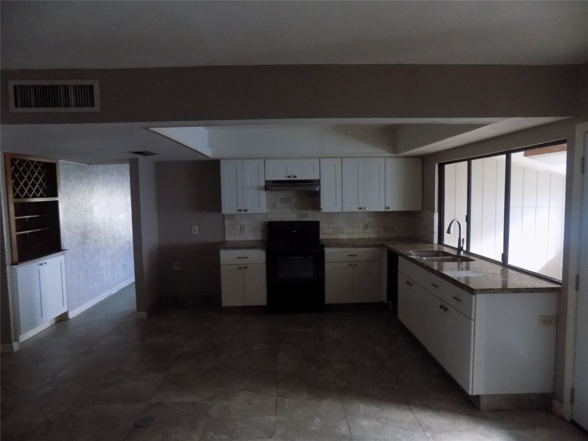 16807 Clan MacIntosh Drive Houston, TX 77084 - Photo 6 of 14 a kitchen with a refrigerator and a sink