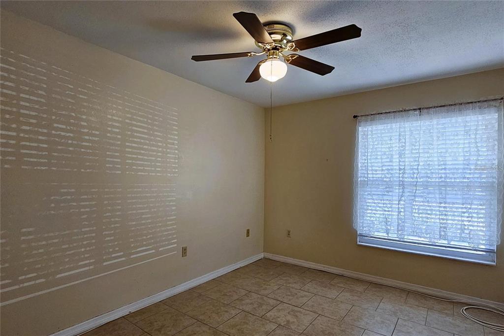 4330 Tahitian Gardens Circle, Unit C Holiday, FL 34691 - Photo 13 of 20 a view of an empty room with a window