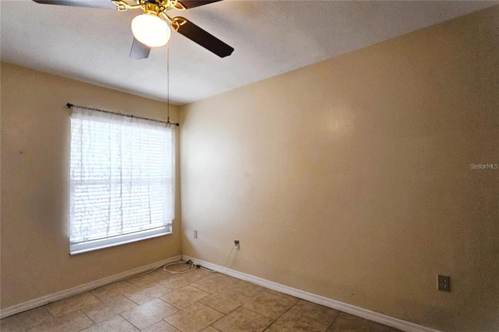 4330 Tahitian Gardens Circle, Unit C Holiday, FL 34691 - Photo 17 of 20 a view of an empty room with a window