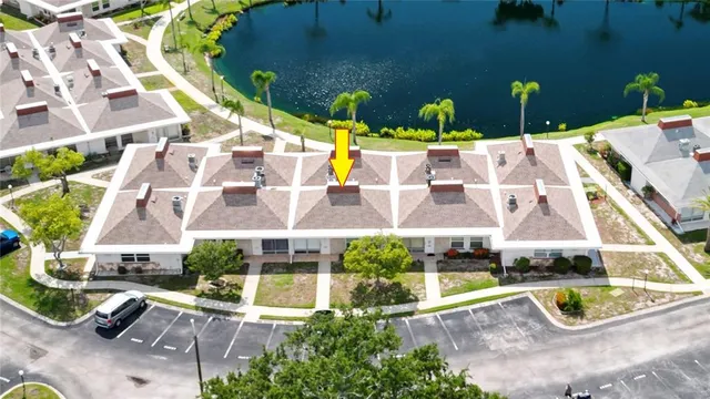 an aerial view of a house with a swimming pool
