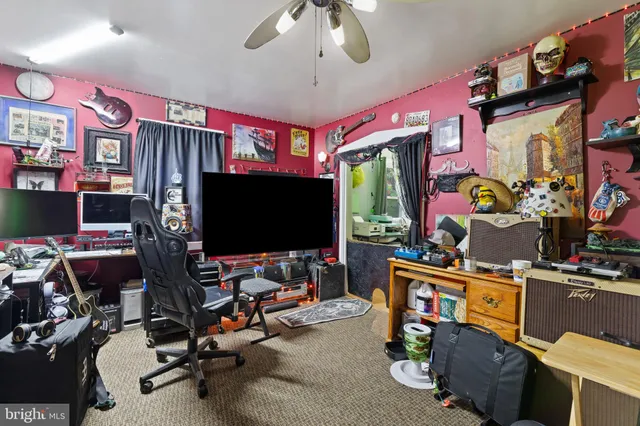 a room with gym equipment and a flat screen tv