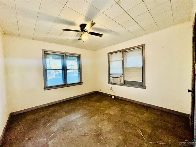 a view of an empty room with a window