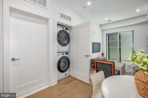 a view of a hallway with washer and dryer