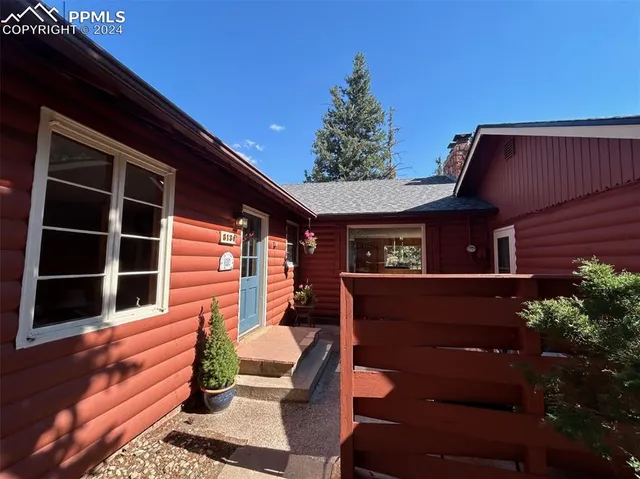 a view of a park with iron fence