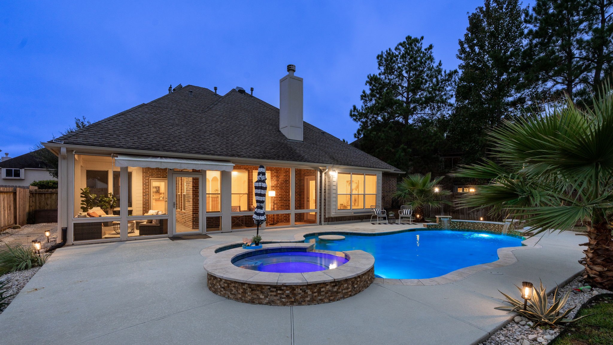 a swimming pool with outdoor seating