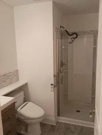 a backyard with potted plants and wooden fence