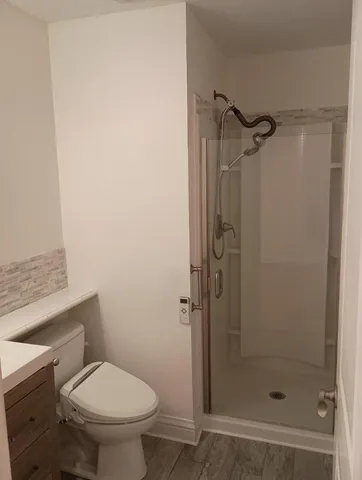 a backyard with potted plants and wooden fence