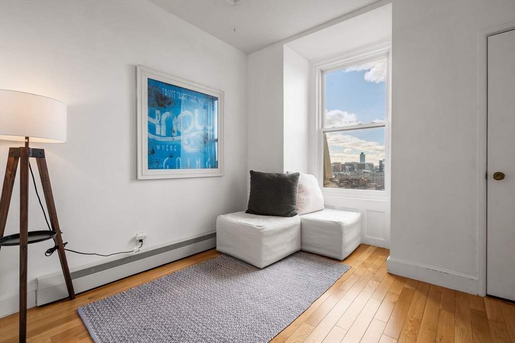 483 Beacon Street, Unit PH4 Boston, MA 02115 - Photo 15 of 18 a living room with furniture and a window