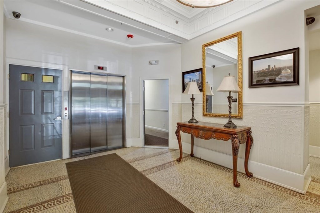 483 Beacon Street, Unit PH4 Boston, MA 02115 - Photo 18 of 18 a living room with furniture
