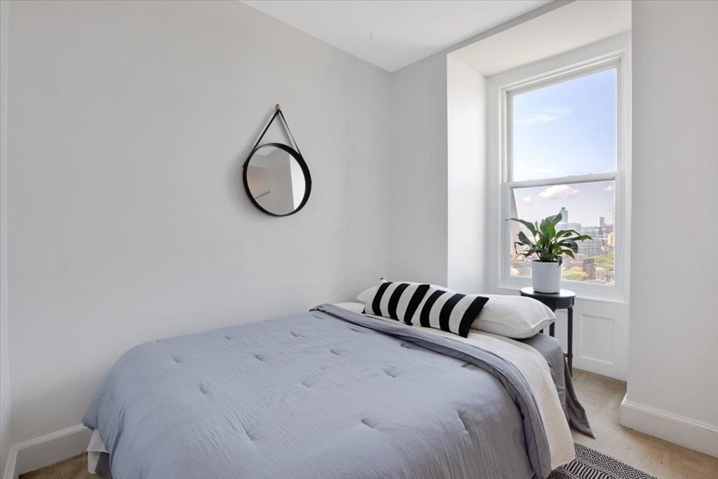 483 Beacon Street, Unit PH4 Boston, MA 02115 - Photo 7 of 18 a bedroom with a bed and a window
