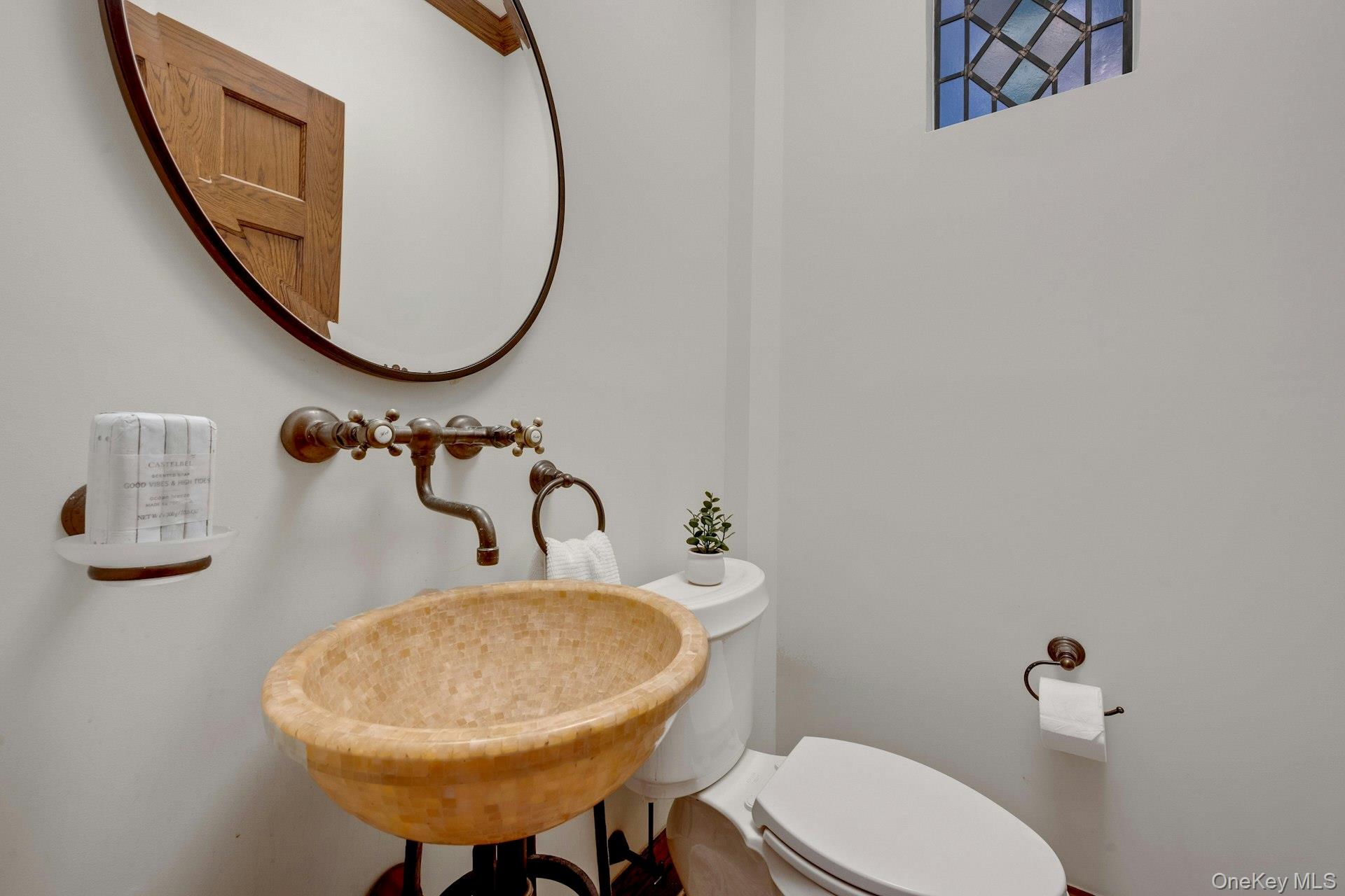 15 Carstensen Road Scarsdale, NY 10583 - Photo 12 of 35 a bathroom with a sink mirror and toilet