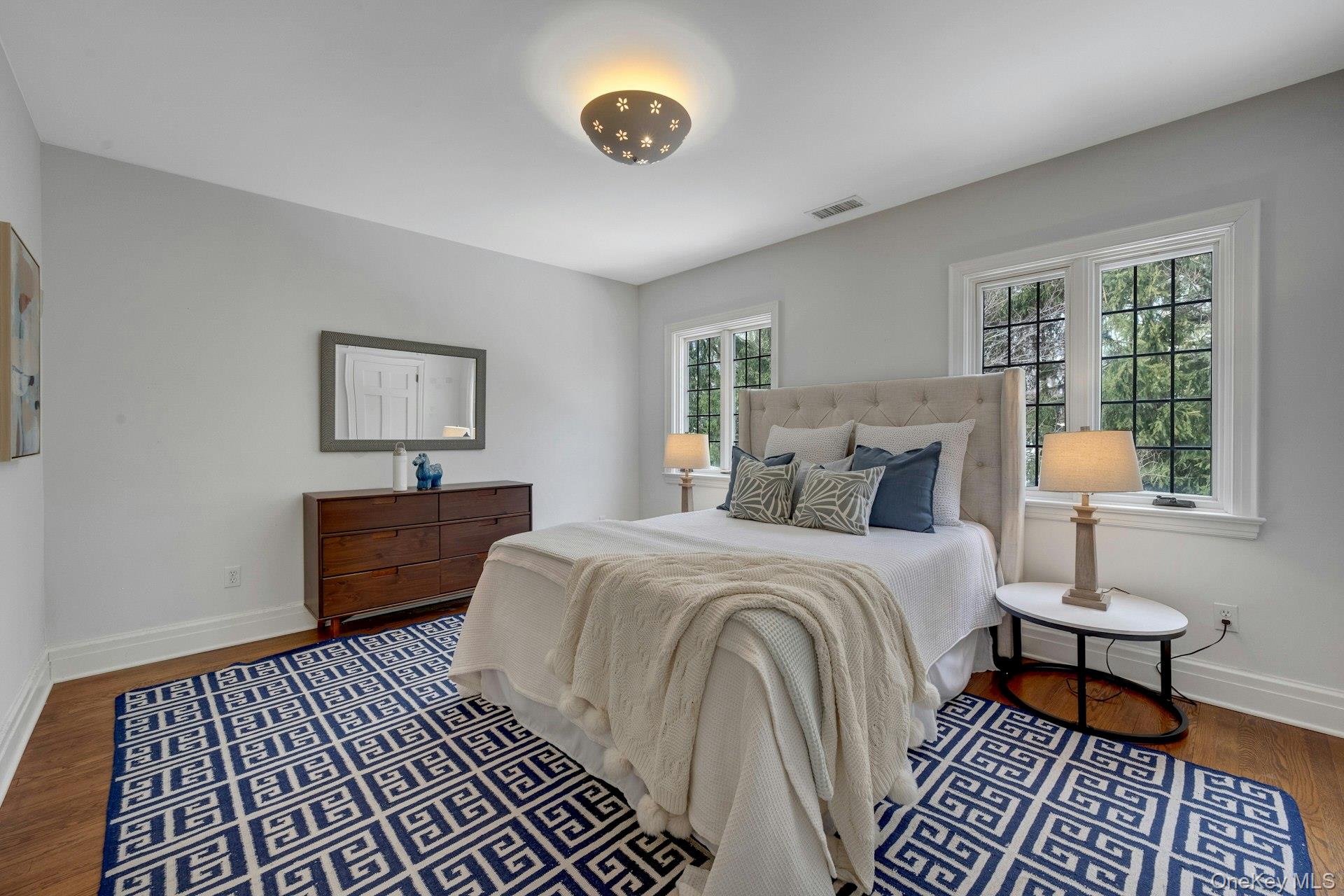 15 Carstensen Road Scarsdale, NY 10583 - Photo 16 of 35 a bed room with a bed and a lamp