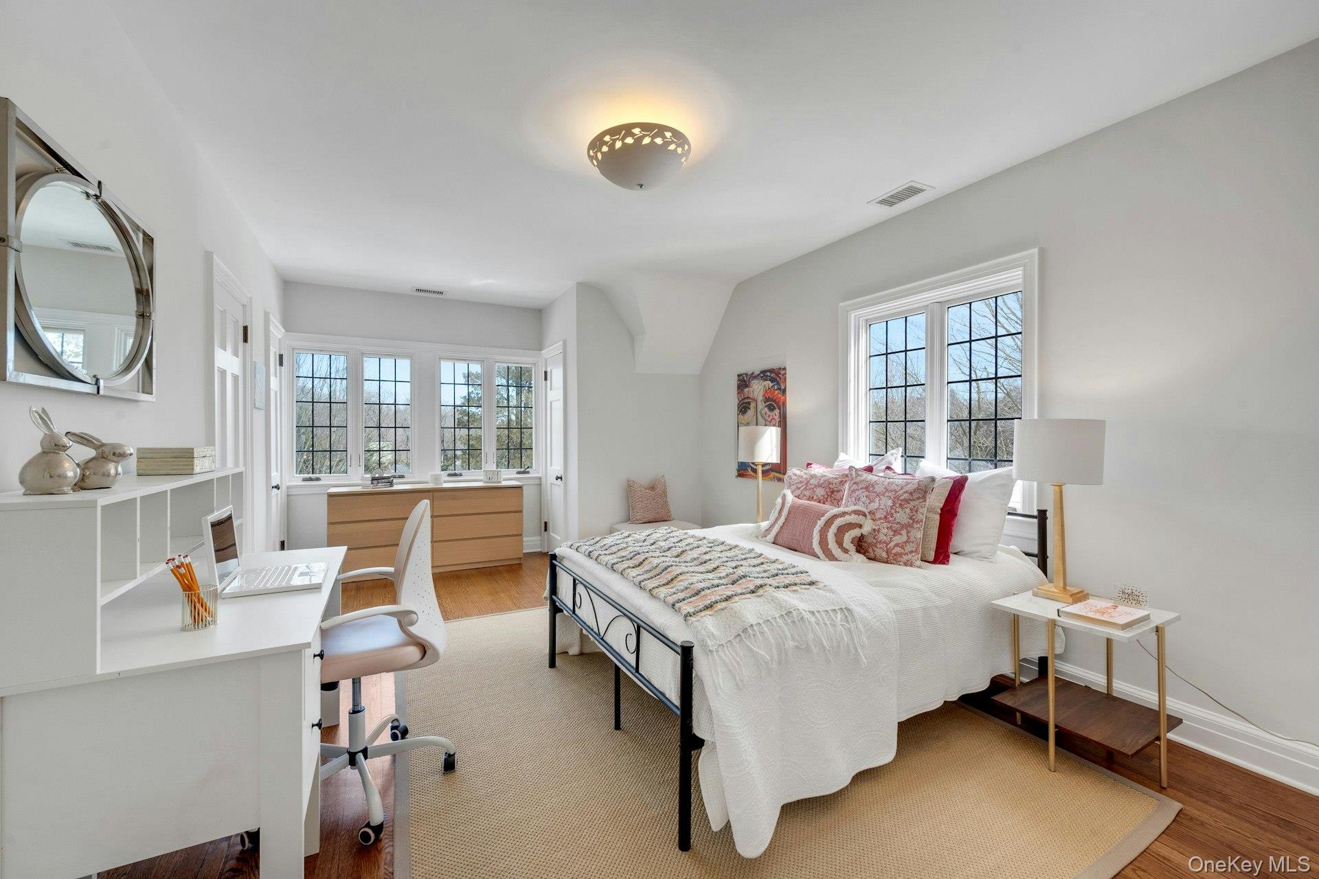 15 Carstensen Road Scarsdale, NY 10583 - Photo 18 of 35 a bedroom with a bed and a large window