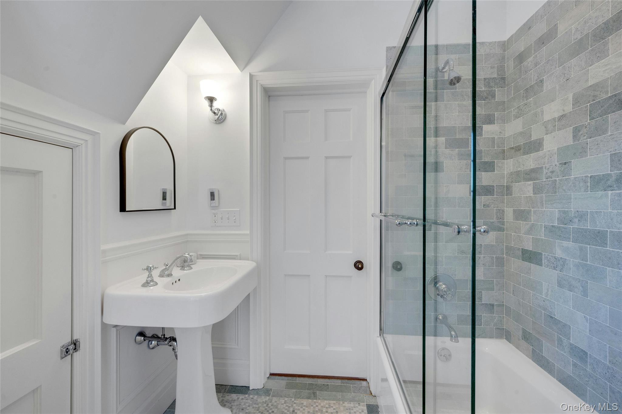 15 Carstensen Road Scarsdale, NY 10583 - Photo 19 of 35 a bathroom with a sink and mirror