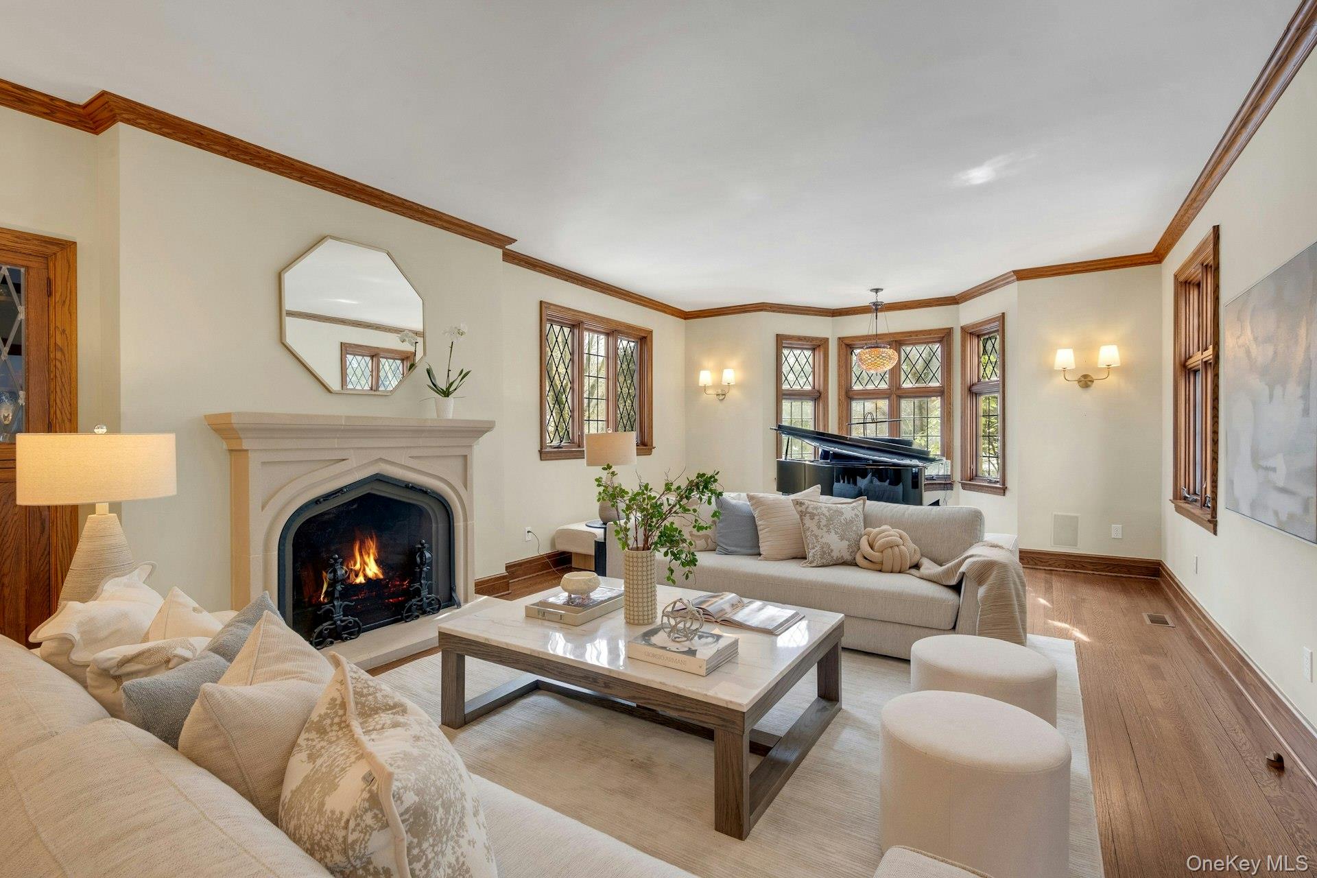 15 Carstensen Road Scarsdale, NY 10583 - Photo 3 of 35 a living room with furniture and a fireplace