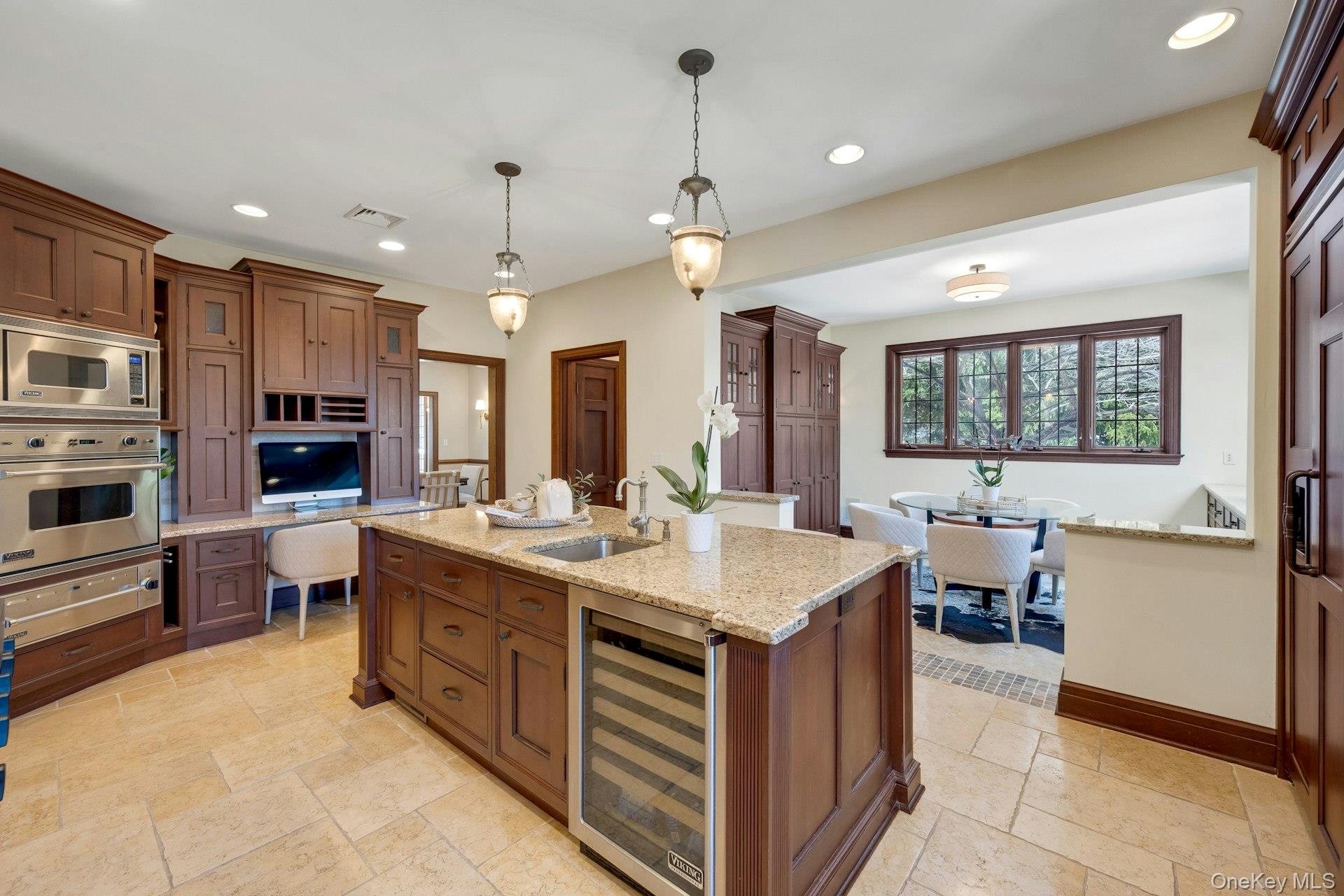 15 Carstensen Road Scarsdale, NY 10583 - Photo 8 of 35 a large kitchen with a counter space a sink appliances and a counter top space