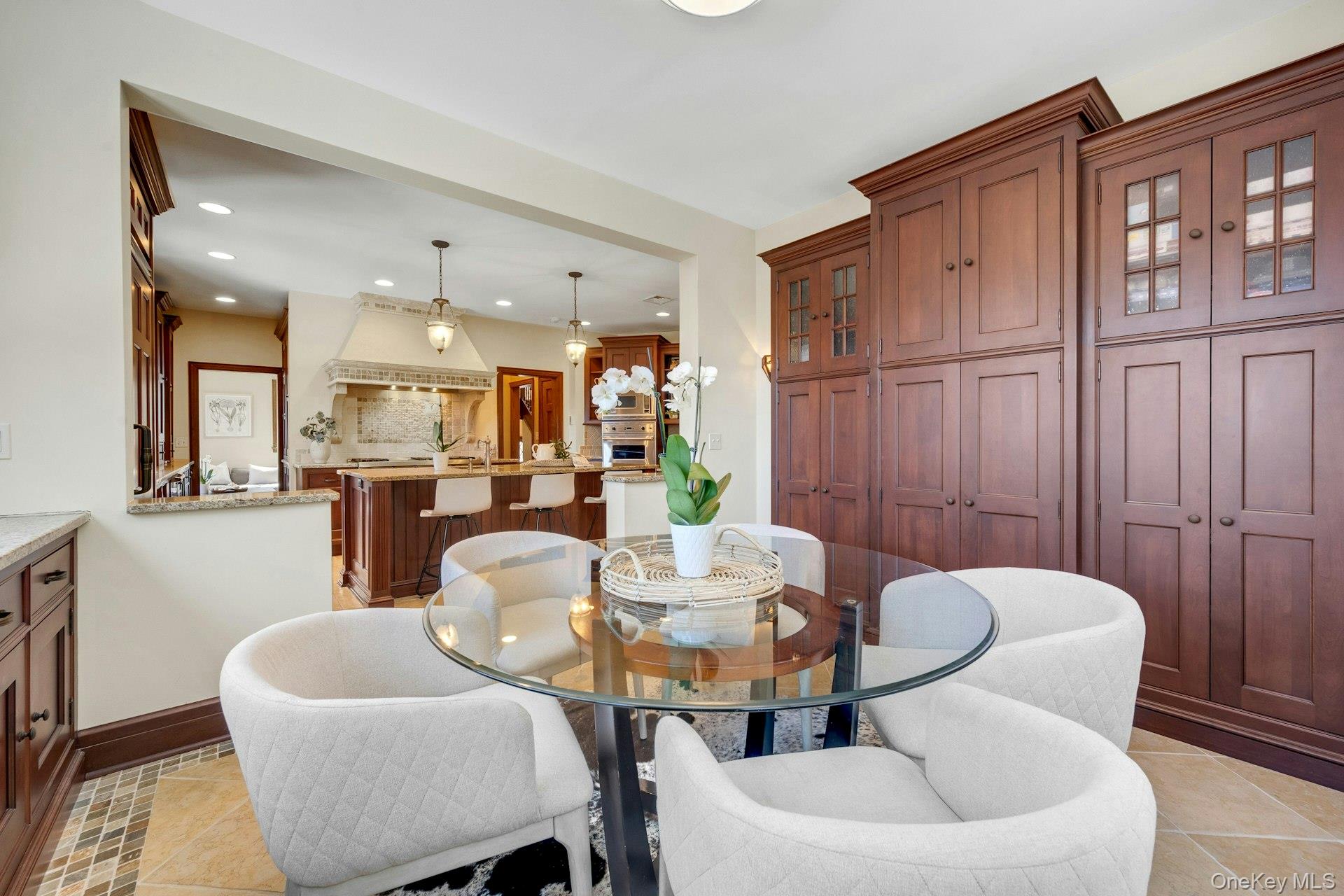 15 Carstensen Road Scarsdale, NY 10583 - Photo 9 of 35 a dining room with furniture and wooden floor
