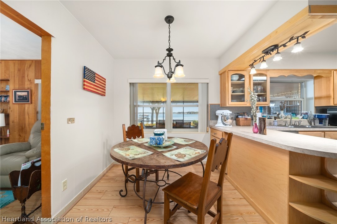 325 Sunset Road Frostproof, FL 33843 - Photo 19 of 48 a dining room with furniture and window