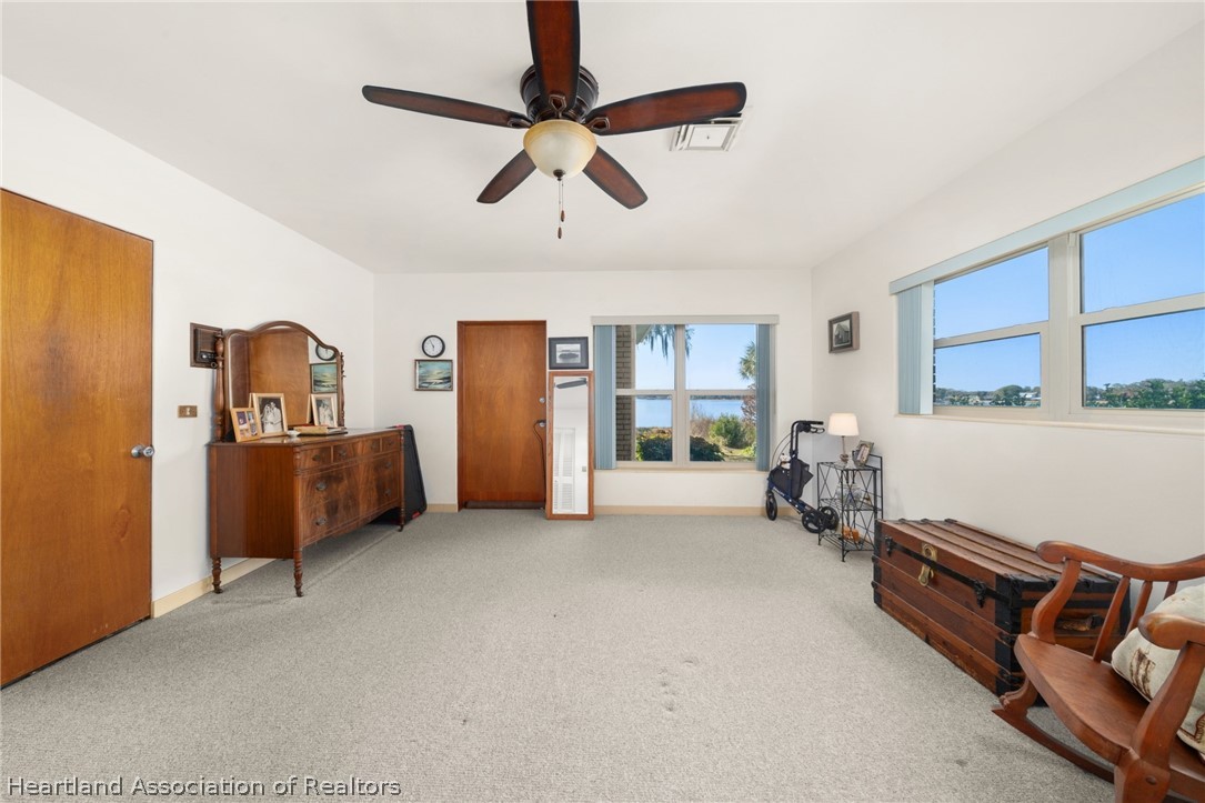 325 Sunset Road Frostproof, FL 33843 - Photo 26 of 48 a room with furniture and a flat screen tv
