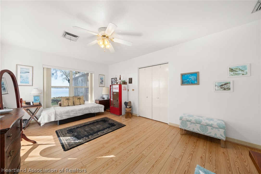 325 Sunset Road Frostproof, FL 33843 - Photo 32 of 48 a living room with furniture and a large window