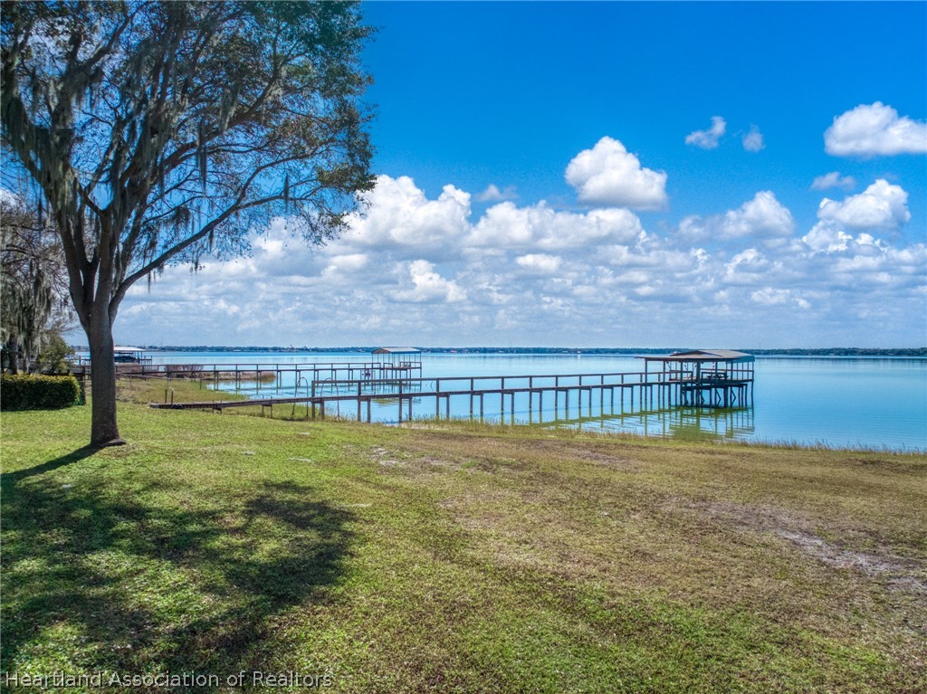 325 Sunset Road Frostproof, FL 33843 - Photo 47 of 48 a view of a lake with a big yard
