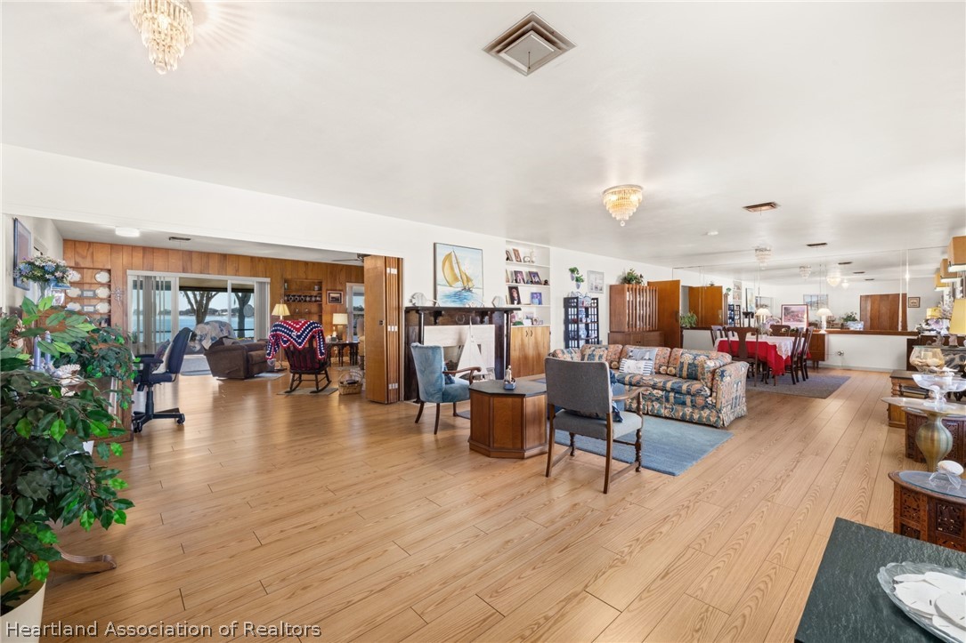325 Sunset Road Frostproof, FL 33843 - Photo 10 of 48 a living room with lots of furniture and kitchen view