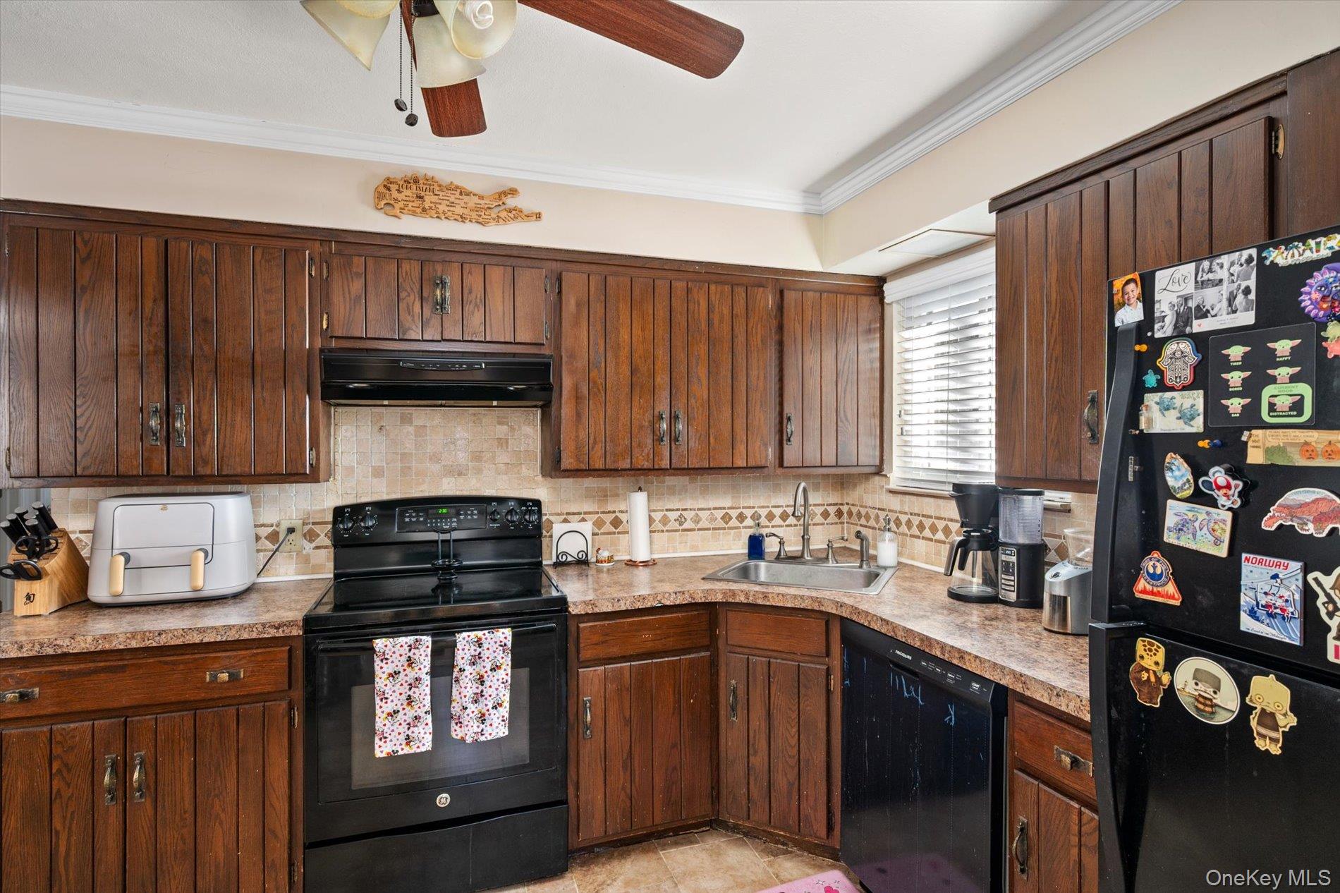 249 Hampton Road West Babylon, NY 11704 - Photo 11 of 22 a kitchen with granite countertop a stove a sink and cabinets