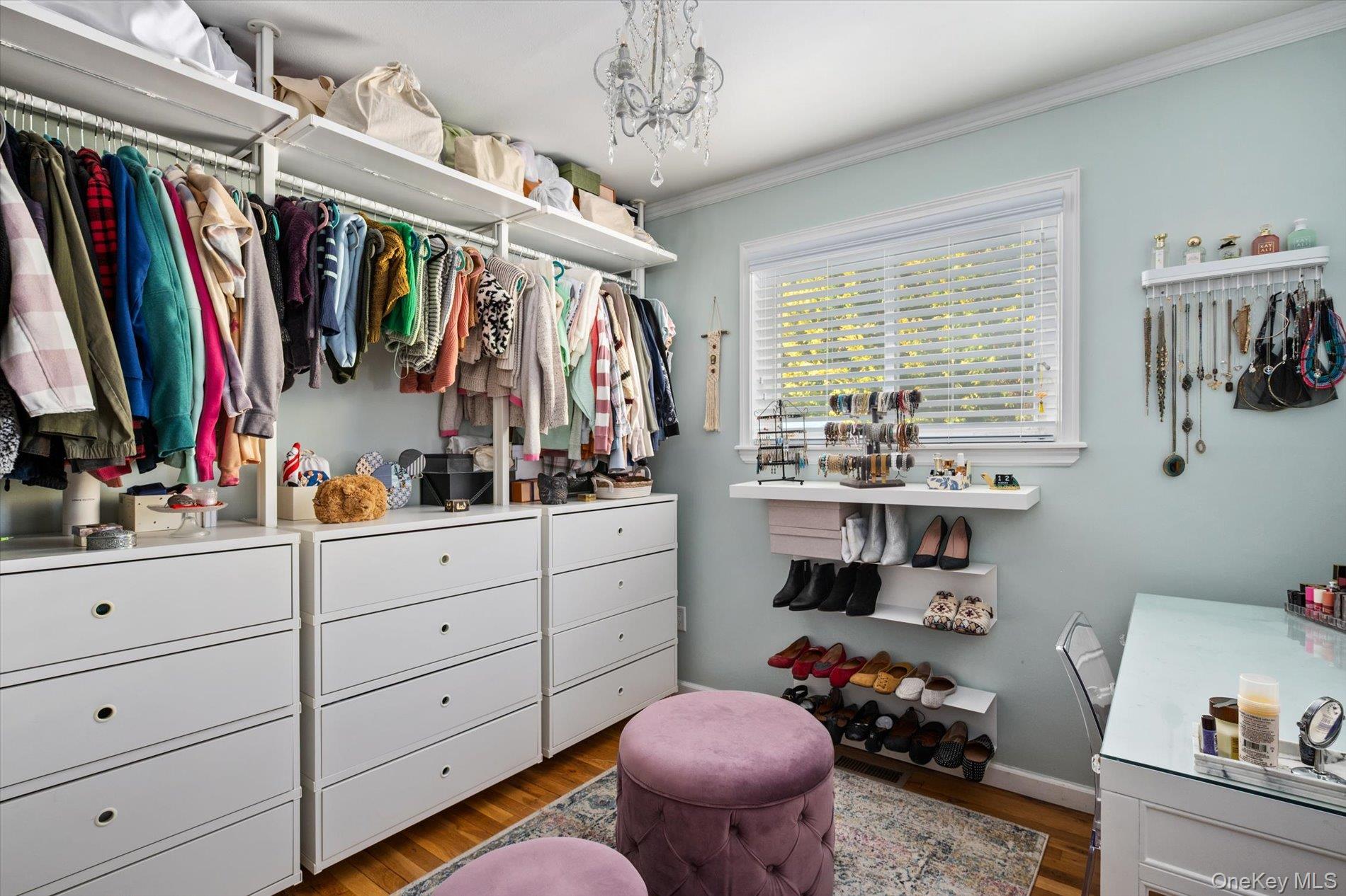 249 Hampton Road West Babylon, NY 11704 - Photo 13 of 22 a view of walk in closet with clothes and shoes