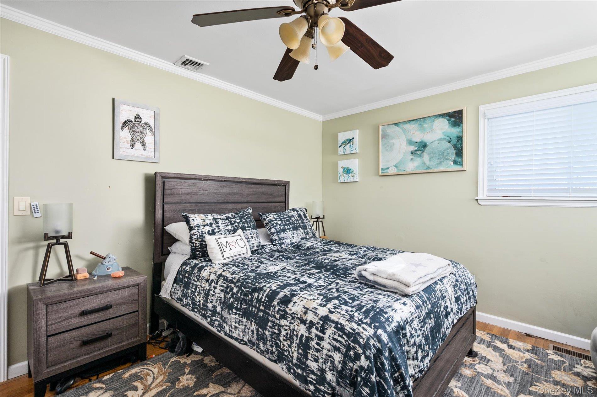 249 Hampton Road West Babylon, NY 11704 - Photo 15 of 22 a bedroom with a bed and lamp