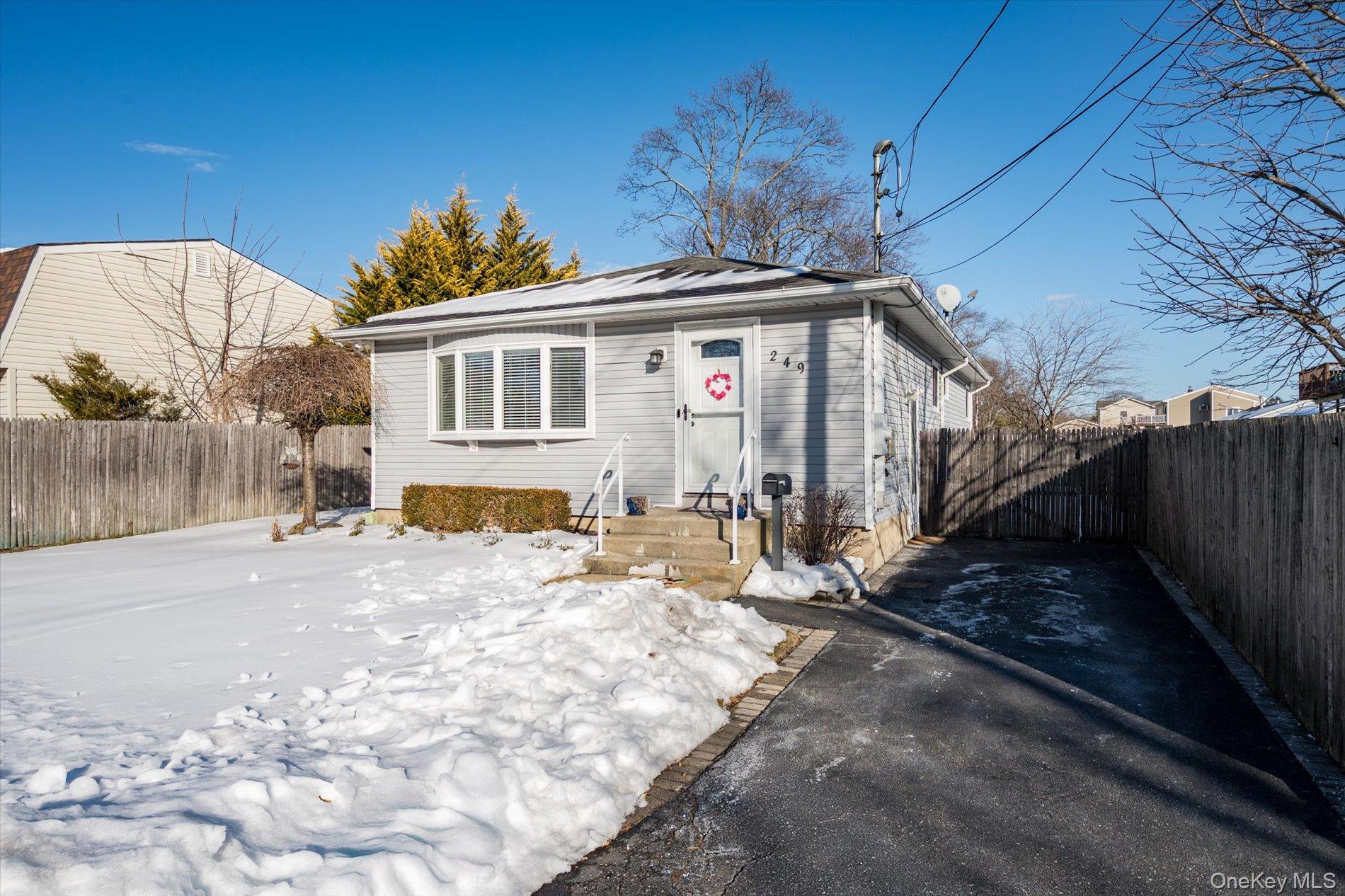249 Hampton Road West Babylon, NY 11704 - Photo 2 of 22 a front view of a house with a yard