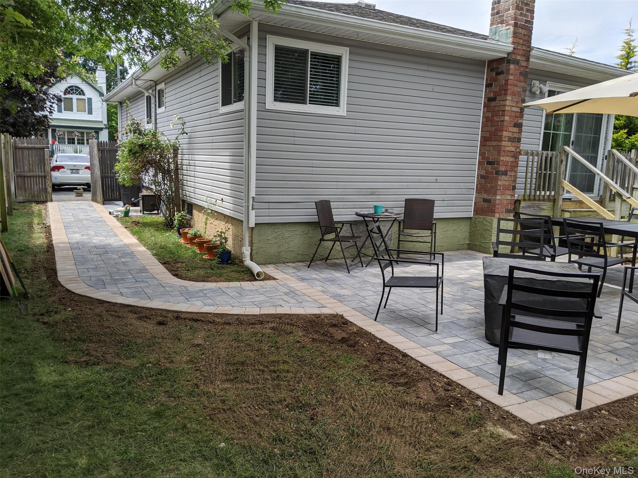 249 Hampton Road West Babylon, NY 11704 - Photo 22 of 22 a view of a house with backyard and sitting area