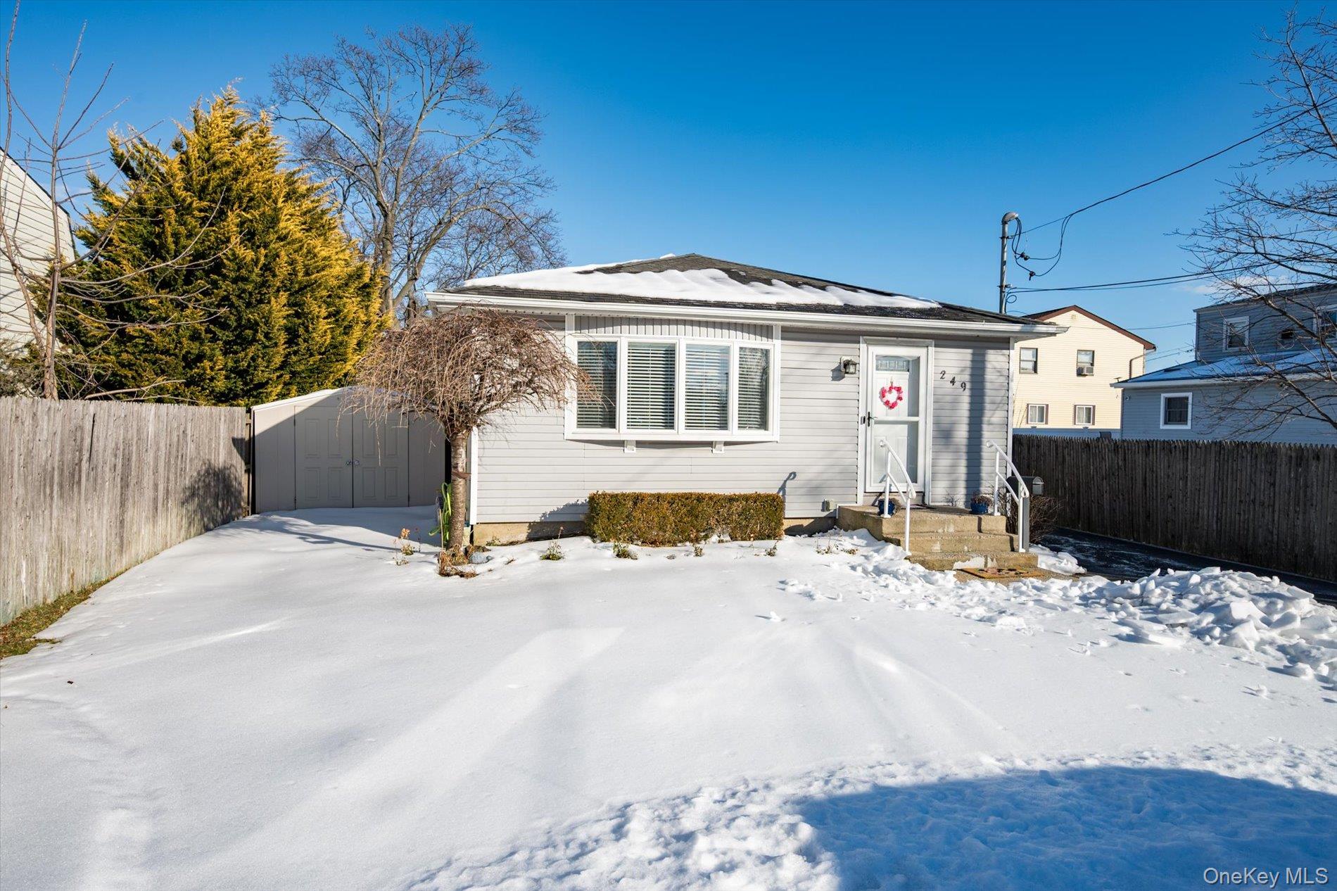 249 Hampton Road West Babylon, NY 11704 - Photo 3 of 22 a front view of a house with a yard
