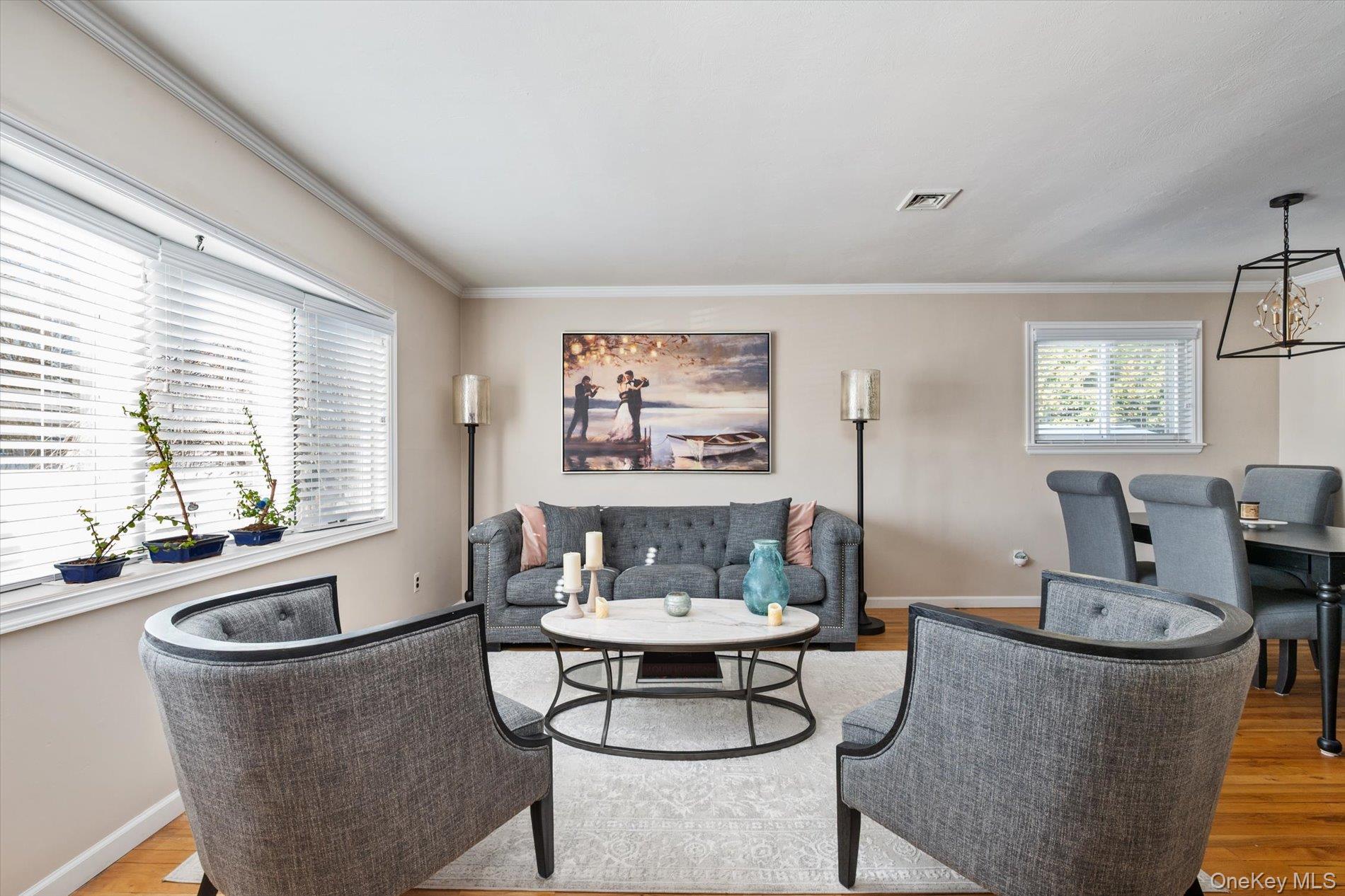 249 Hampton Road West Babylon, NY 11704 - Photo 4 of 22 a living room with furniture and a large window