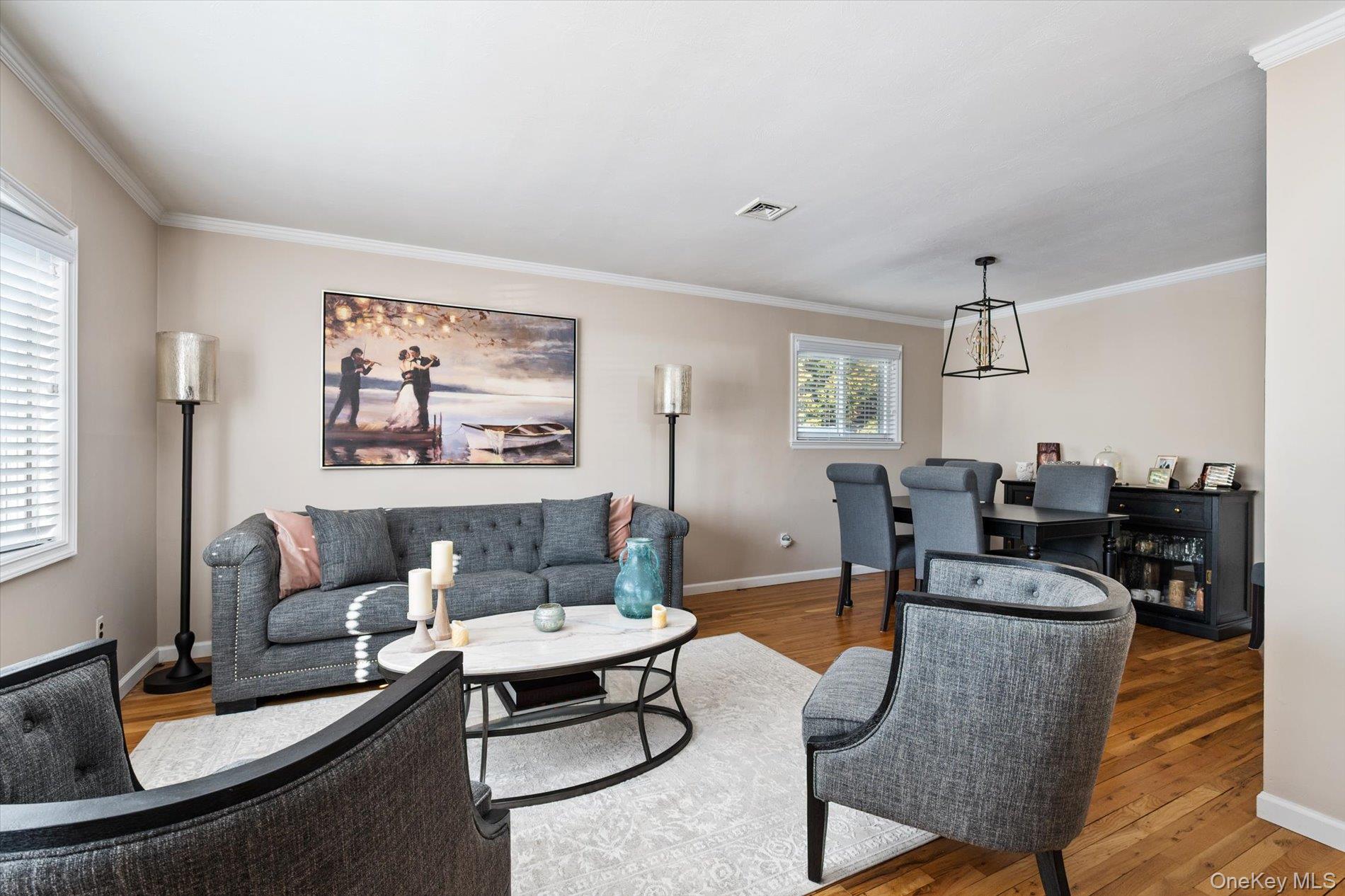 249 Hampton Road West Babylon, NY 11704 - Photo 5 of 22 a living room with furniture and a table