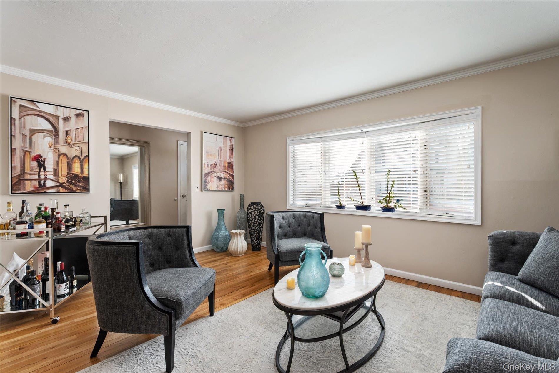 249 Hampton Road West Babylon, NY 11704 - Photo 6 of 22 a living room with furniture and a large window