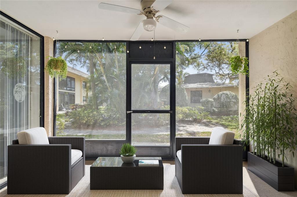 12300 Vonn Road, Unit 3102 Largo, FL 33774 - Photo 9 of 22 a living room with furniture and a large window