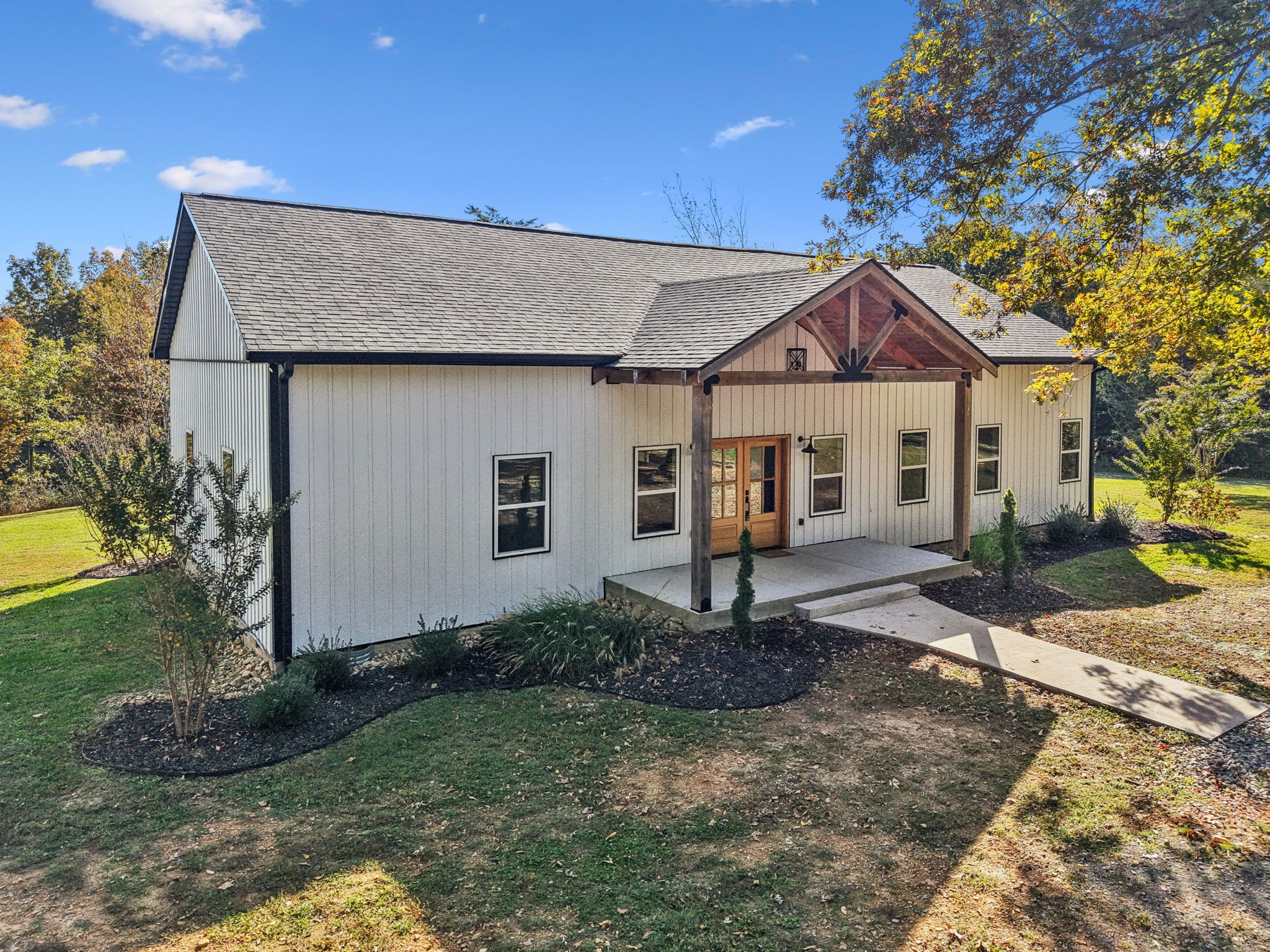 a front view of a house with garden