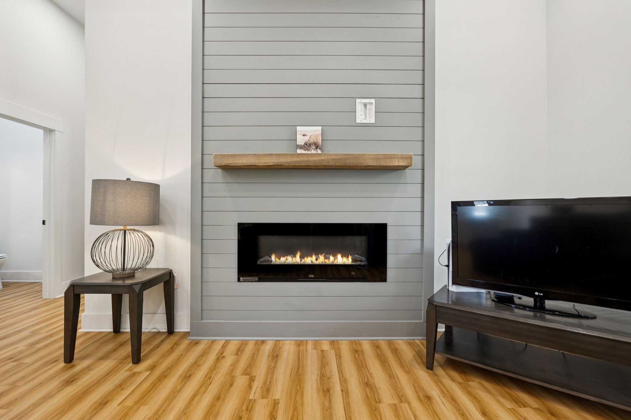 6060 Washer Road Lyles, TN 37098 - Photo 11 of 43 a living room with a flat screen tv and a fireplace