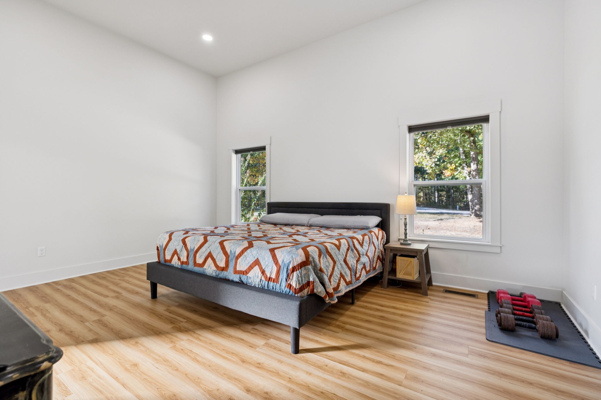 6060 Washer Road Lyles, TN 37098 - Photo 17 of 43 a bedroom with a bed and wooden floor