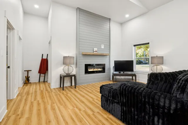 a living room with furniture and a fireplace