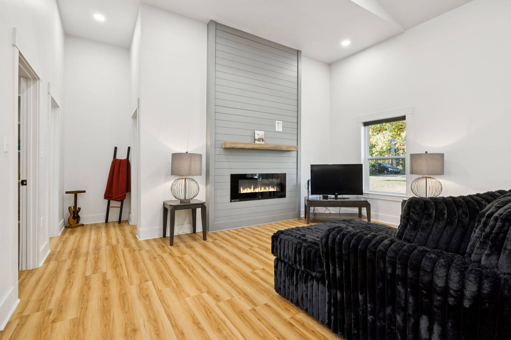 6060 Washer Road Lyles, TN 37098 - Photo 9 of 43 a living room with furniture and a fireplace