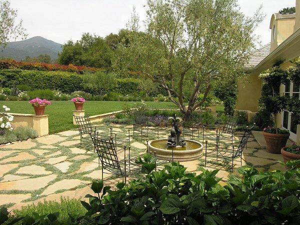 640 Ashley Road Montecito, CA 93108 - Photo 2 of 14 a view of a lake with a table and chairs under an umbrella