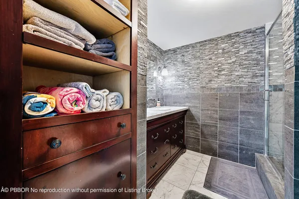 a bathroom with a sink vanity granite and a mirror