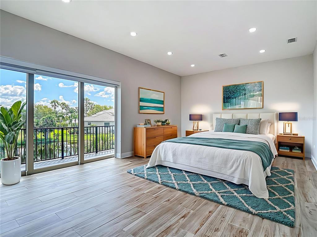 1329 Jumana Loop Apollo Beach, FL 33572 - Photo 18 of 40 a bedroom with a large bed and a large window